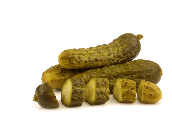 Green pickles and a cut one — Stock Photo, Image