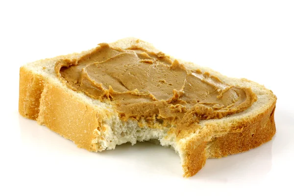 Sliced white bread with peanut butter — Stock Photo, Image