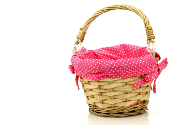 Empty wicker basket with pink cloth — Stock Photo, Image