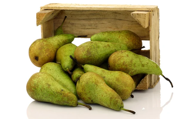 Fresh juicy pears coming out of a wooden box — Stock Photo, Image