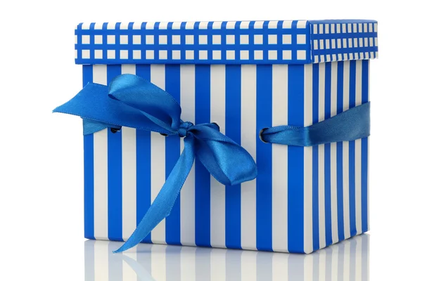 Blue and white gift box with a blue ribbon — Stock Photo, Image