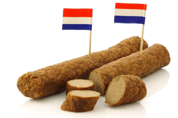 Twee Nederlandse snacks genaamd "fricandel" met Nederlandse vlag tandenstokers en sommige stukken gesneden — Stockfoto