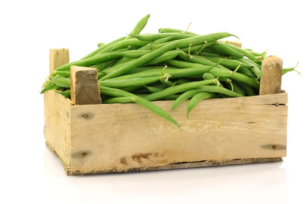 Bunch of green beans in a wooden box — Stok fotoğraf