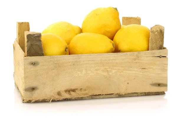 Fresh lemons in a wooden box — Stock Photo, Image