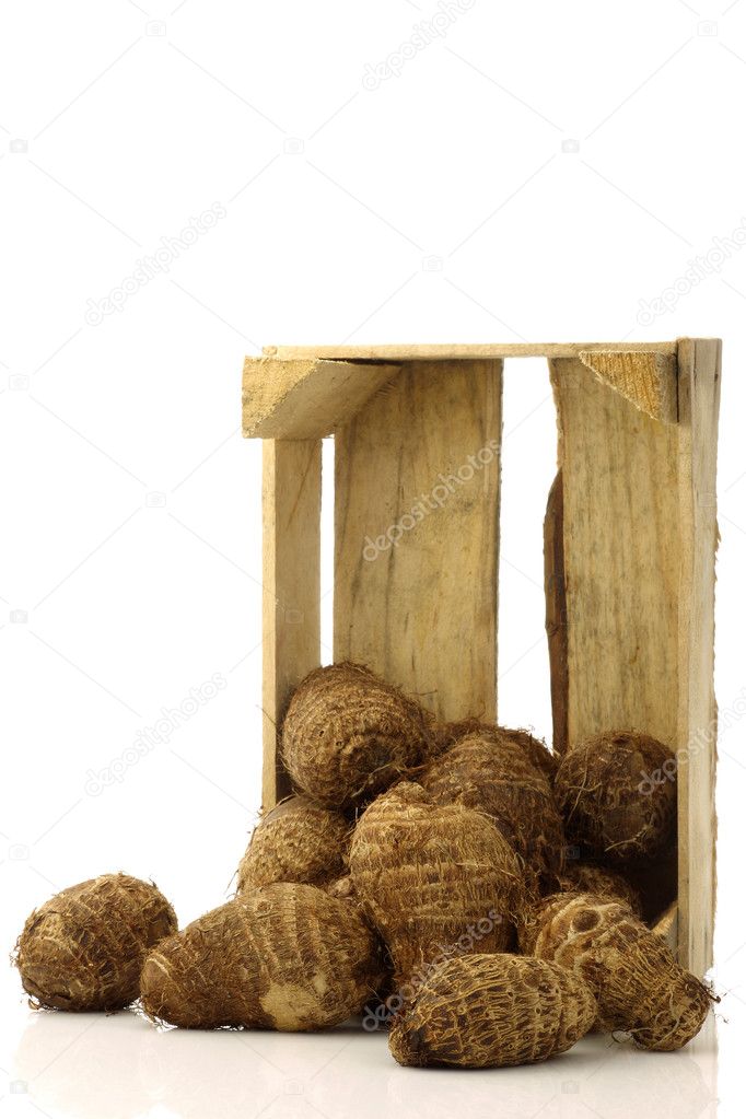 Bunch of taro root(colocasia) in a wooden crate