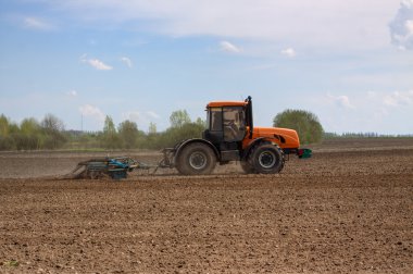 Tractor in the field clipart