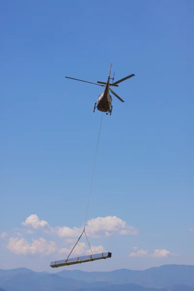Helicopter with load — Stock Photo, Image