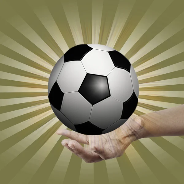 Pallone da calcio in mano. — Foto Stock