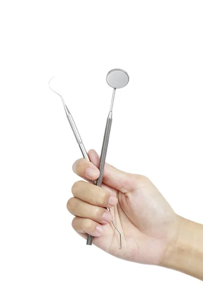 Diş diş bakımı için metal Tıbbi donatım araçları ile el — Stok fotoğraf