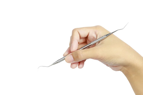 Hand met metalen medische apparatuur tools voor tanden tandheelkundige zorg — Stockfoto
