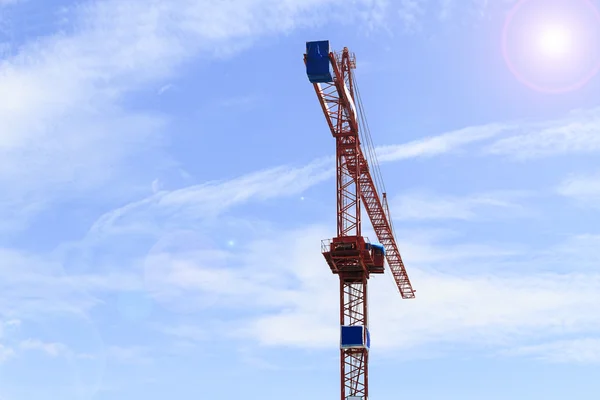 Red crane on blue sky — Stock Photo, Image