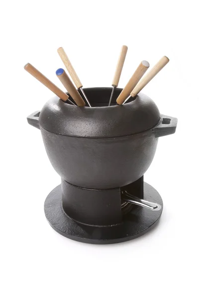 Cast iron fondue and six forks — Stock Photo, Image