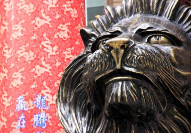 Lion Statue and Traditional Chinese Background clipart