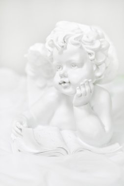 Sculpture of an angel on white background clipart