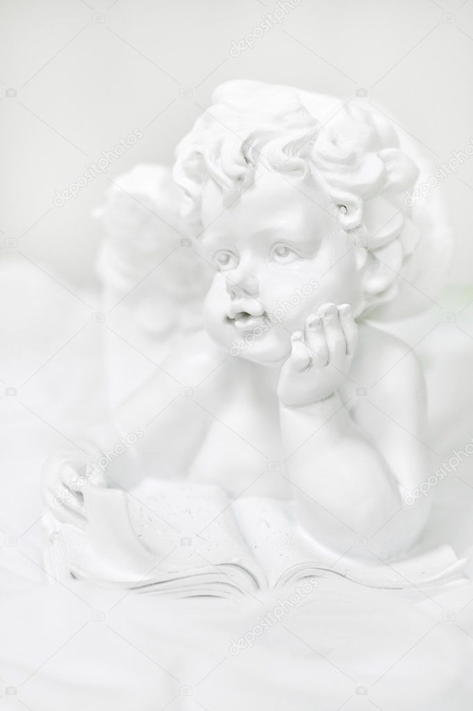 Sculpture of an angel on white background