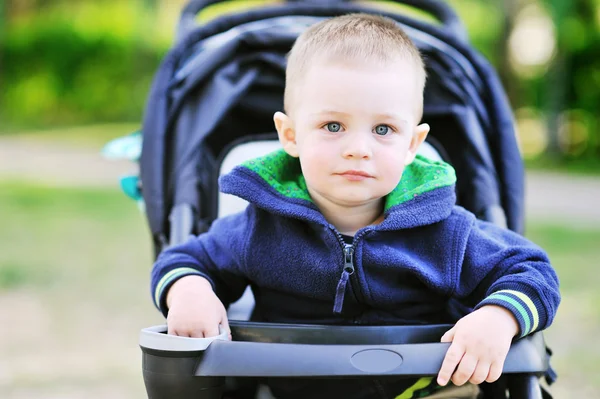 Sweet little boy in the pram outdoors - Closeup — Stock Photo, Image