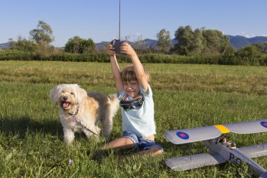 Yesss! Happy Young boy with new toy clipart