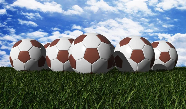 Brown soccer ball on a green grass — Stock Photo, Image