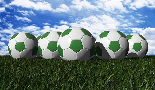 Green soccer ball on a green grass — Stock Photo, Image