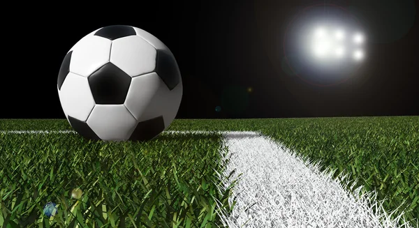 Futbol topu ile light stadyum alanında — Stok fotoğraf