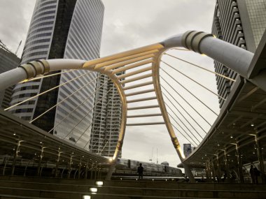 Black and white effect of Pubic skywalk with modern buildings, b clipart