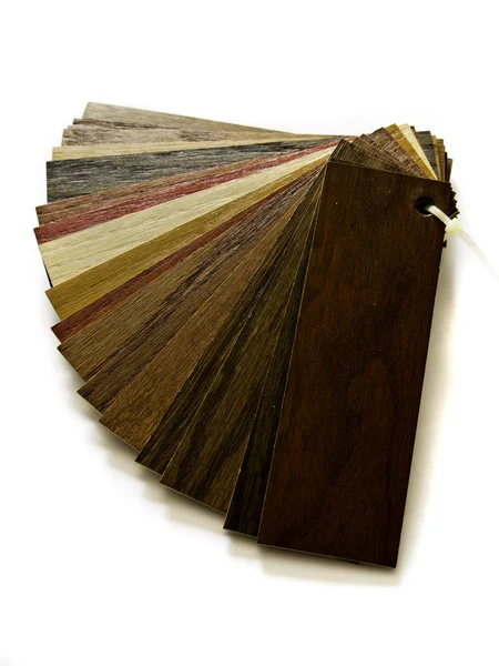 Sample pack of wooden flooring laminate on white background — Stock Photo, Image