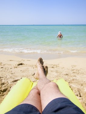 Resting in the beach clipart