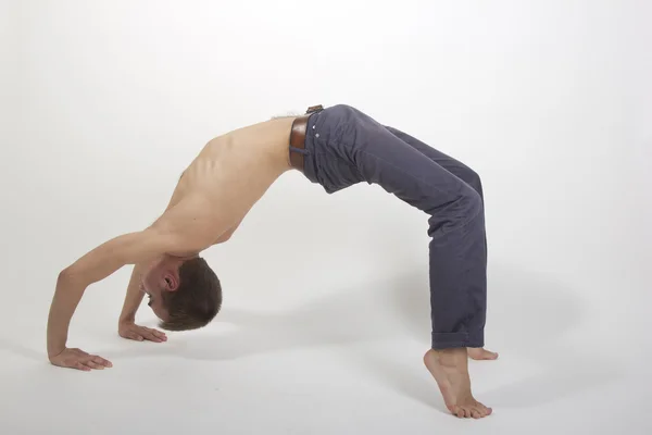 stock image Young handsome fitness sportsman doing yoga exercises isolated