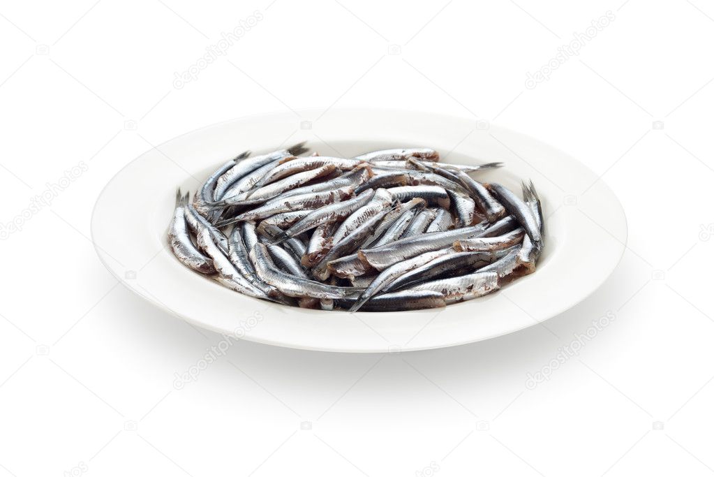 Fresh anchovies prepared seafood dish and shadow on white backgr