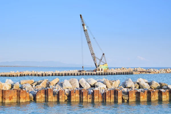 stock image Crawler Crane at work on a river and sea shore