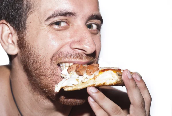 En man äter pizza — Stockfoto
