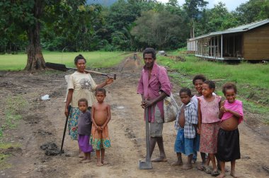 Family in village Papua New Guinea clipart