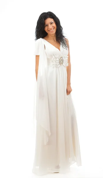 Menina bonita em vestido branco de pé no fundo branco . — Fotografia de Stock