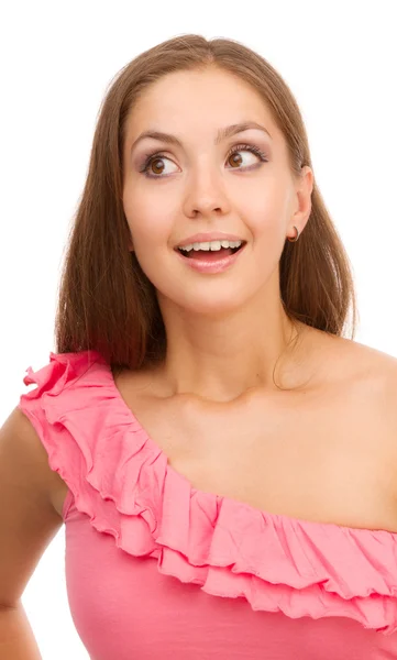Portret van een glimlachende meisje in een roze jurk op een witte achtergrond. — Stockfoto