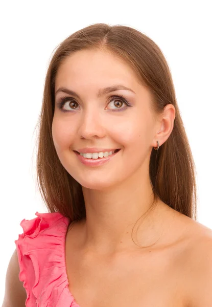 Portré egy mosolygó lány egy rózsaszín ruha fehér alapon. — Stock Fotó