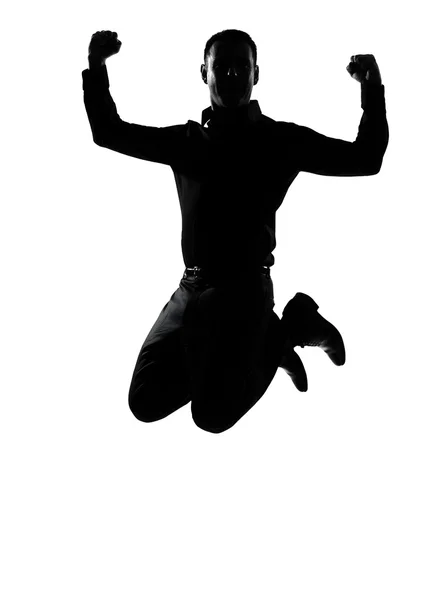 Um homem de negócios pulando silhueta poderosa — Fotografia de Stock