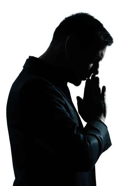 Jeden biznes człowiek myśli modląc się sylwetka — Zdjęcie stockowe