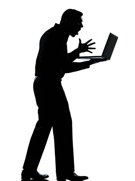 Un hombre de negocios silueta computación ordenador portátil enojado disp —  Fotos de Stock