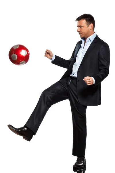 Een zakenman spelen voetbal jongleren — Stockfoto