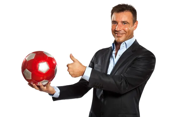 Μία επιχείρηση άνθρωπος που κρατά την εμφάνιση μιας μπάλας ποδοσφαίρου — Φωτογραφία Αρχείου