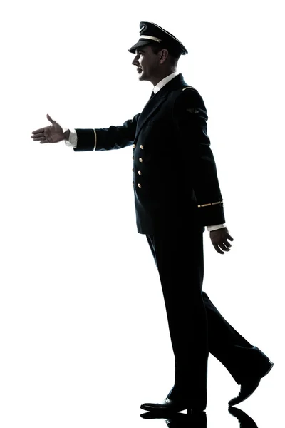 Man in airline pilot uniform silhouette walking handshake — Stock Photo, Image