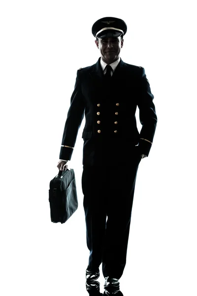 Homme en ligne pilote uniforme silhouette marche — Photo