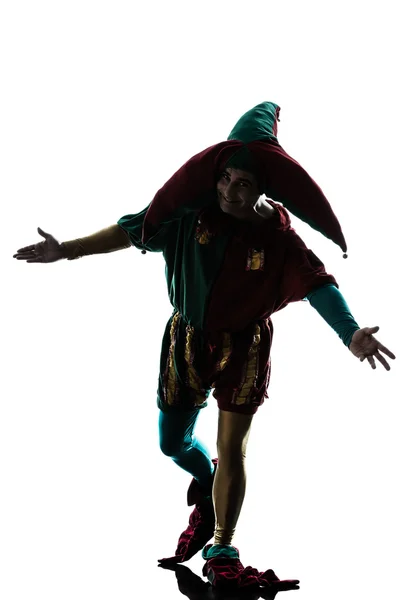 Man in jester costume silhouette saluting — Stock Photo, Image
