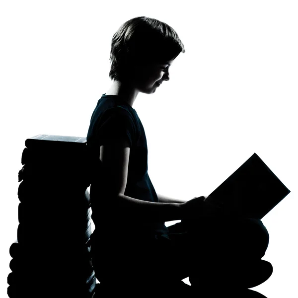 One caucasian young teenager silhouette boy or girl reading — Stock Photo, Image