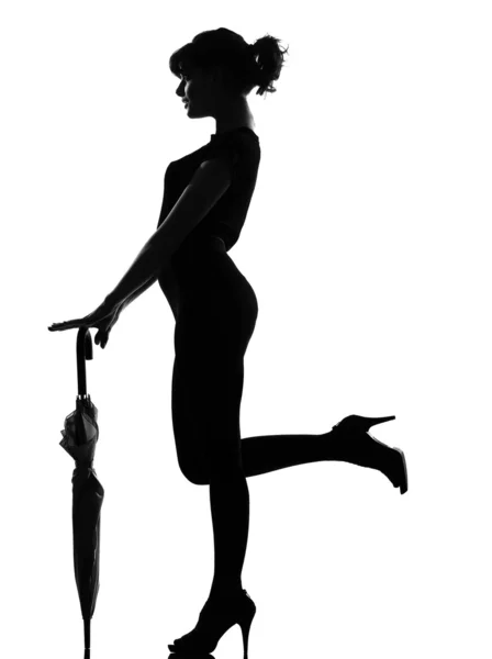 Silhouette nő tartja zárva esernyő — Stock Fotó