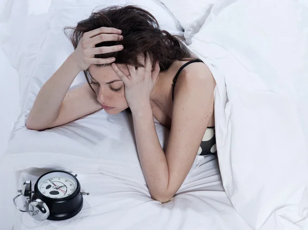 Woman in bed awakening — Stock Photo, Image