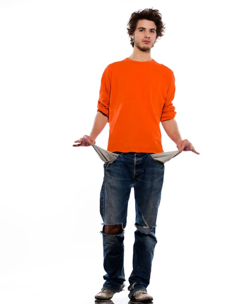Young man poor showing empty pockets — Stock Photo, Image