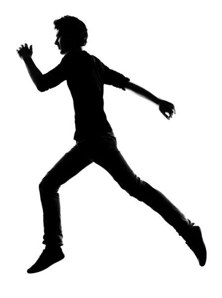 Jovem correndo silhueta — Fotografia de Stock