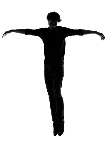 Young man silhouette jumping happy — Stock Photo, Image
