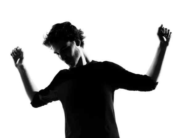 Young man silhouette dancing happy — Stock Photo, Image